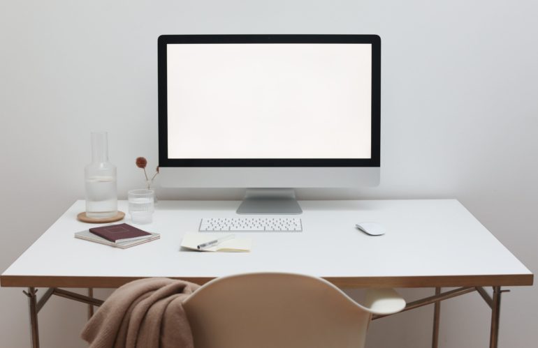 Free Stylish workspace with computer and simple furniture Stock Photo