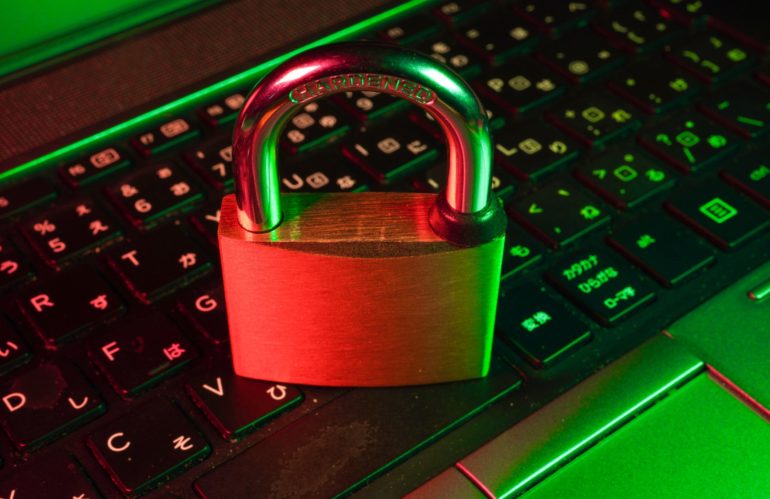 red padlock on black computer keyboard