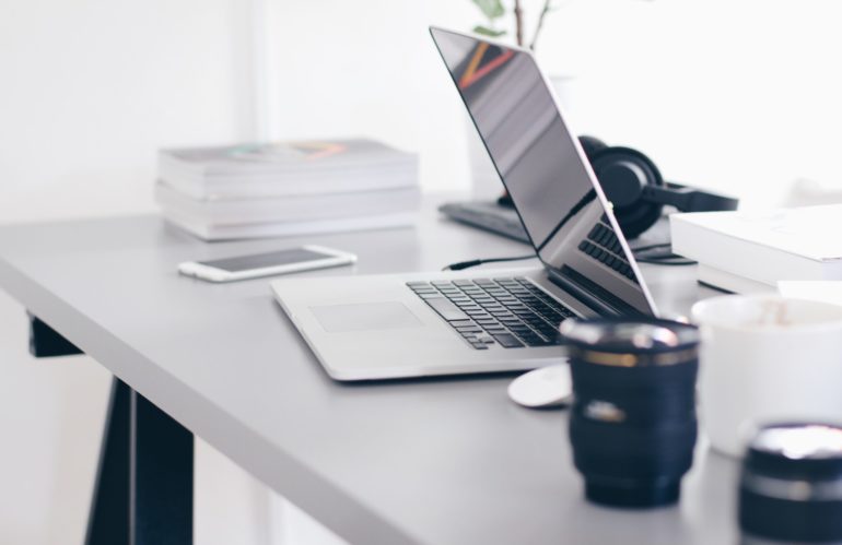 Free Gray Laptop on Table Top Stock Photo