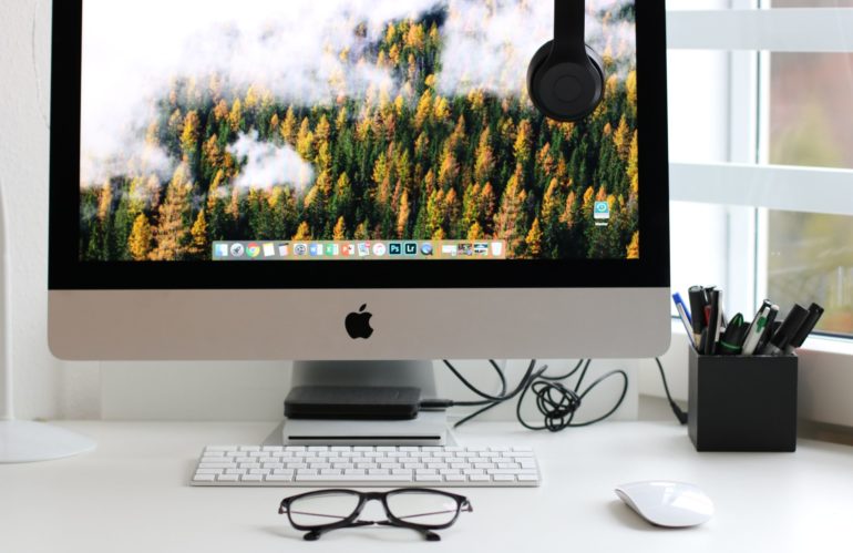 Free Turned on Silver Imac With Might Mouse and Keyboard Stock Photo