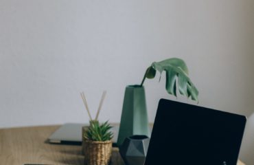 Free Black Laptop Computer On Brown Wooden Table Stock Photo