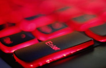 a close up of a red and black keyboard