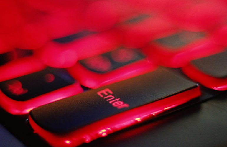 a close up of a red and black keyboard