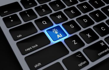 a computer keyboard with a blue light on it